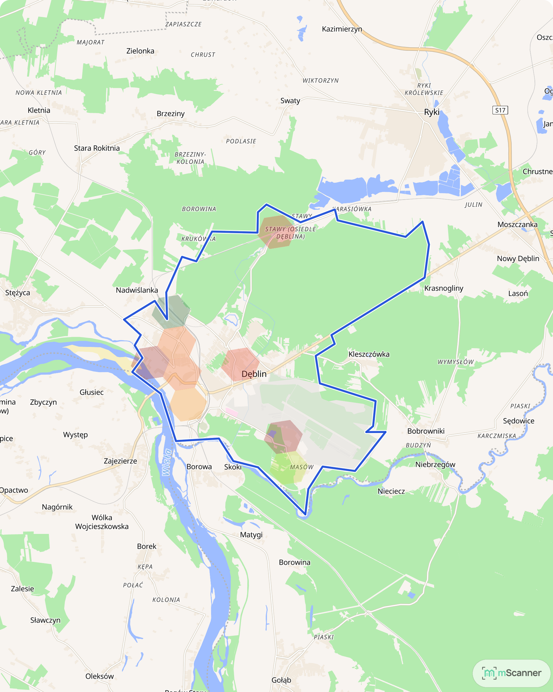 Mapa cen transakcyjnych mieszkań w Dęblinie, z niebieskim obrysem granic miasta i kolorowymi polami cen skupionymi w zabudowanej części miasta.