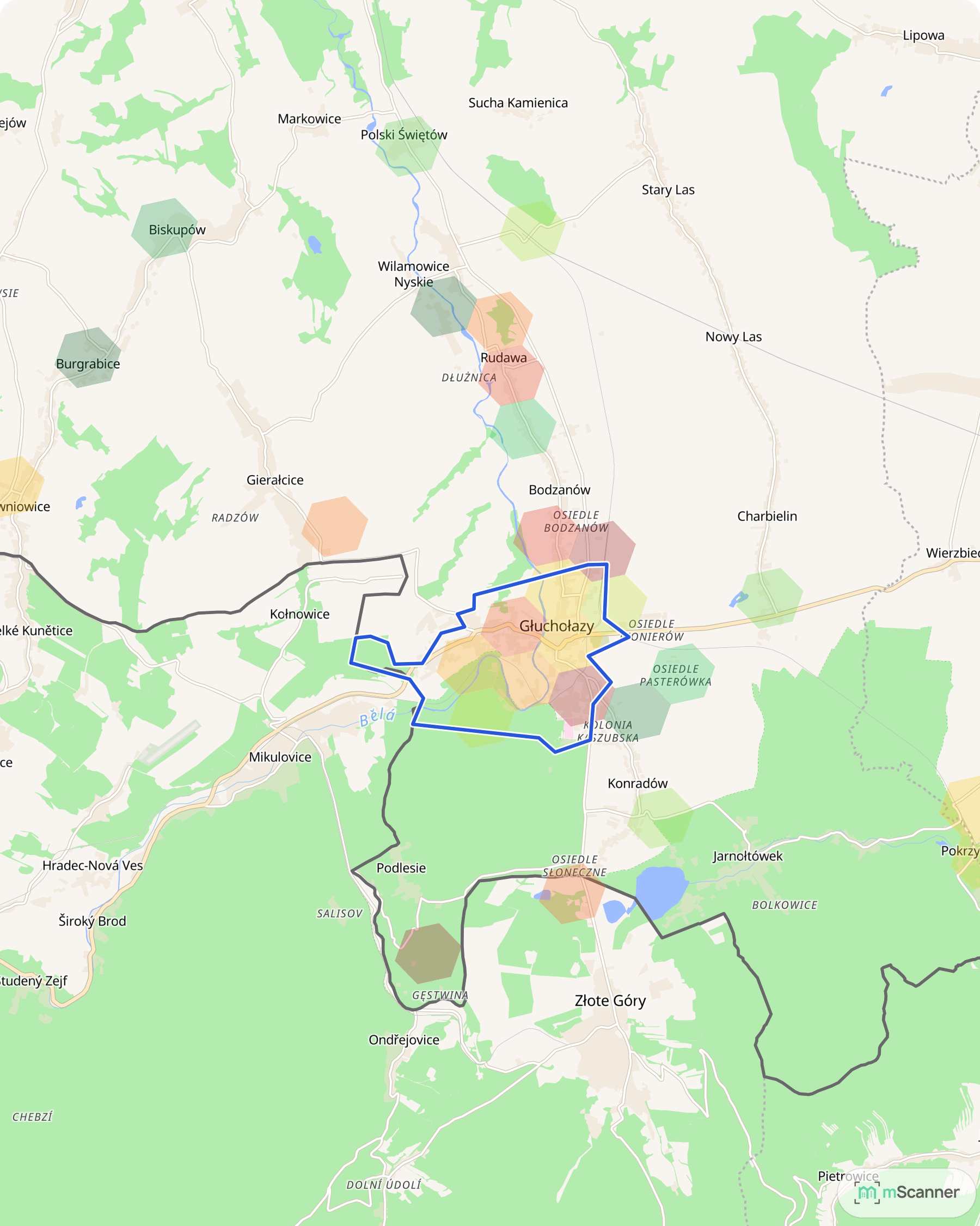 Mapa cen transakcyjnych mieszkań w Głuchołazach, z niebieskim obrysem granic miasta u podnóża Gór Opawskich i pojedynczymi sześciokątnymi polami cen rozsianymi po gminie aż po granicę z Czechami.