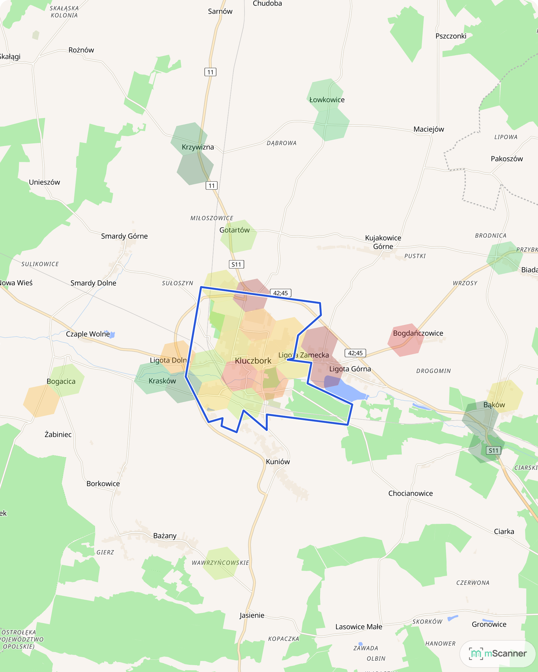 Mapa cen transakcyjnych mieszkań w Kluczborku, z niebieskim obrysem granic miasta i sześciokątnymi polami cen skupionymi wokół rynku i osiedla przy Skłodowskiej-Curie.