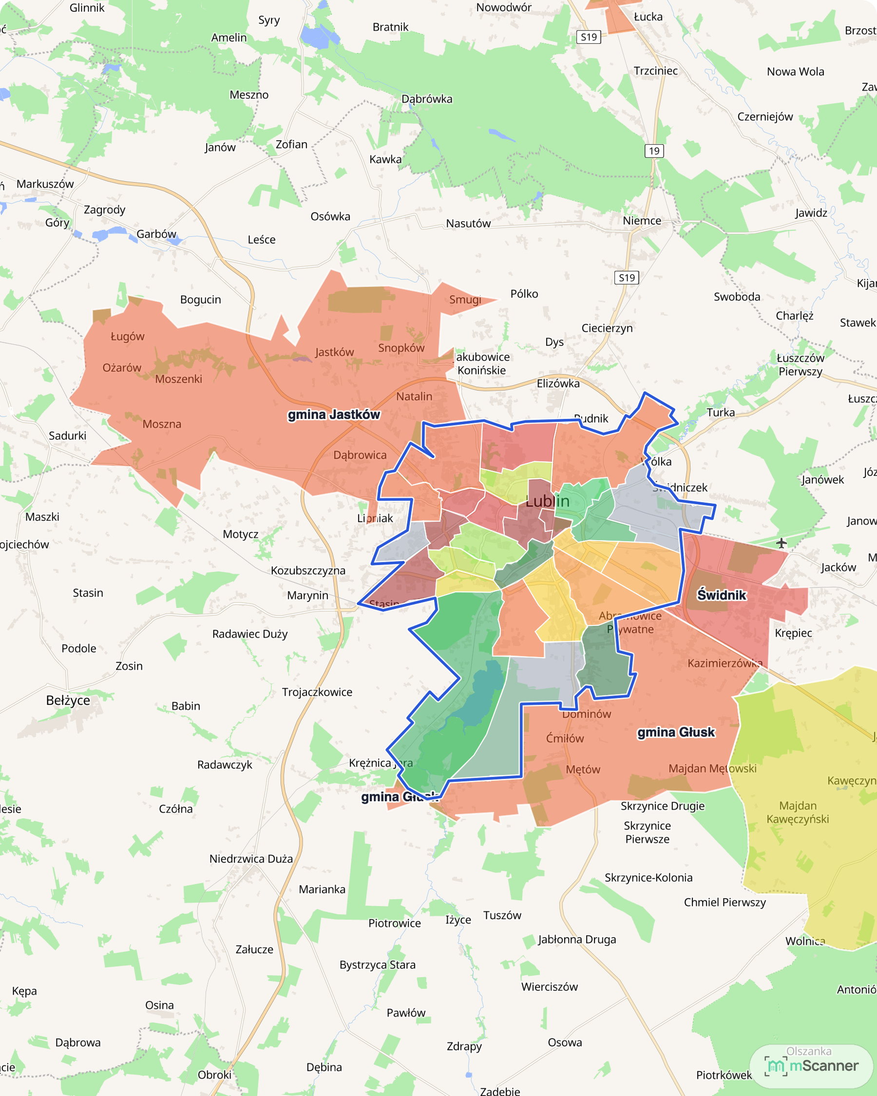 Mapa cen transakcyjnych mieszkań w Lublinie i okolicy, z niebieskim obrysem granic Lublina w środku oraz Świdnikiem na wschodzie, Jastkowem na północy i gminą Głusk na południu.