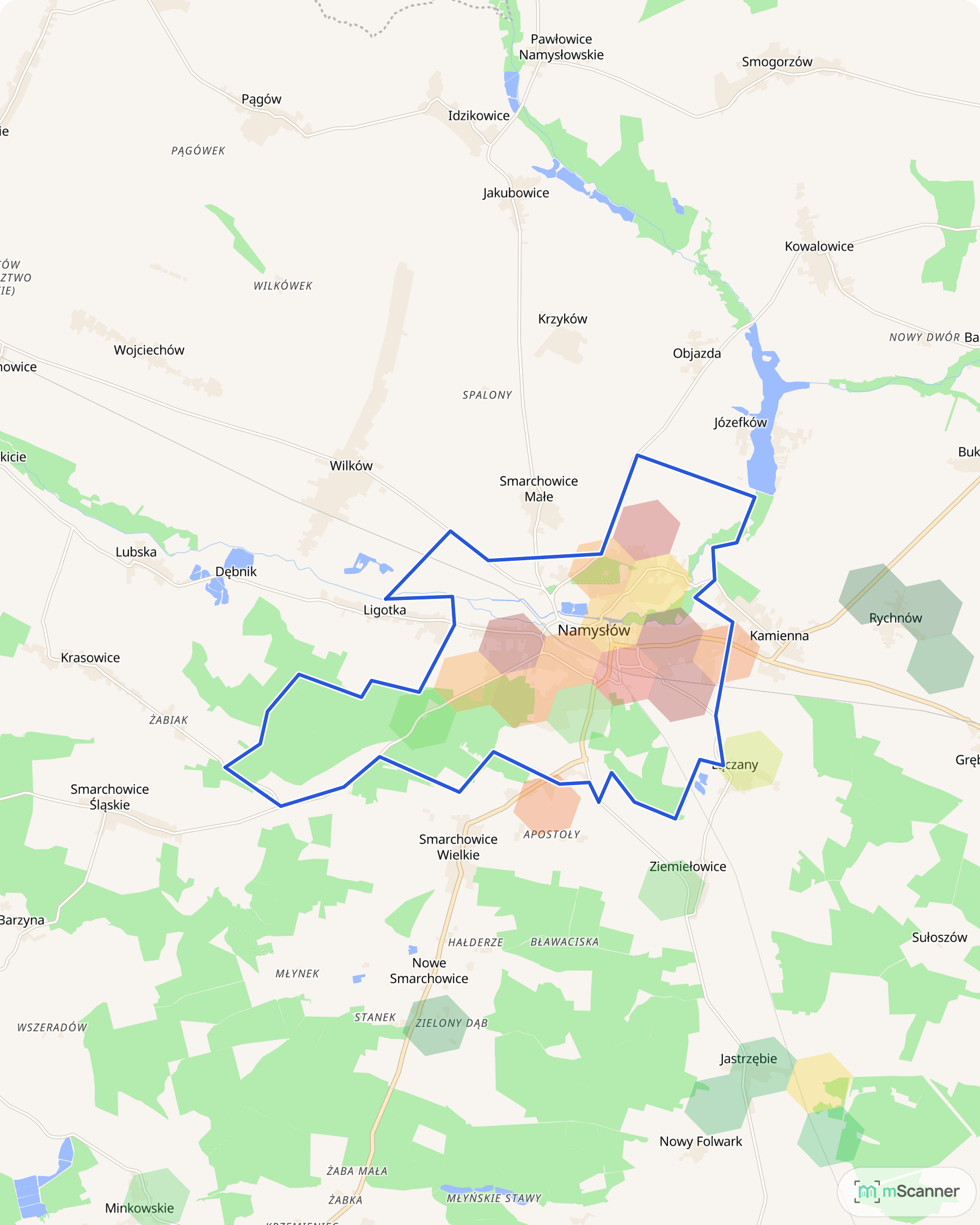 Mapa cen transakcyjnych mieszkań w Namysłowie, z niebieskim obrysem granic miasta i ciemniejszymi sześciokątnymi polami cen tam, gdzie stoją cztery nowe bloki przy 1 Maja i Bohaterów Warszawy.