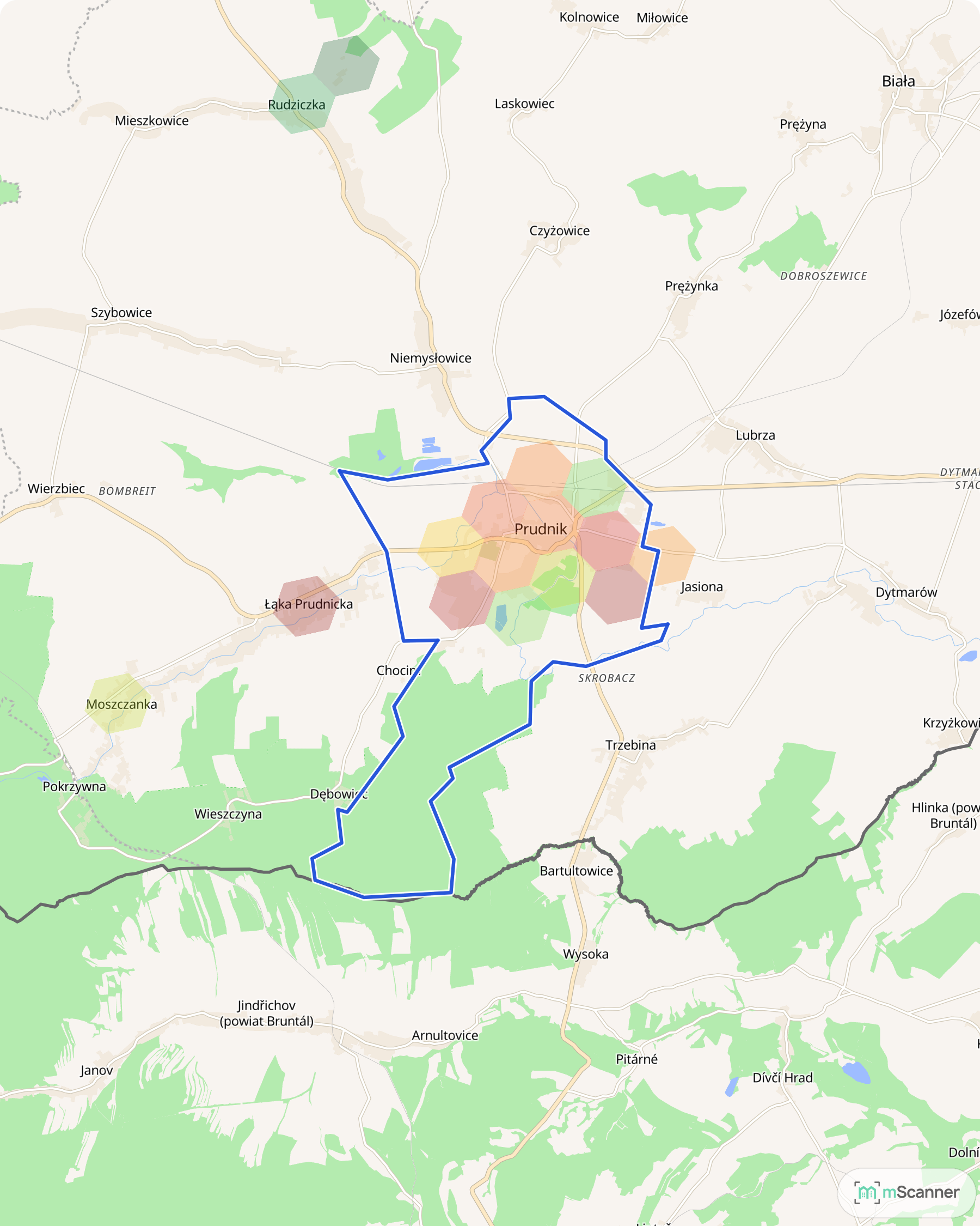 Mapa cen transakcyjnych mieszkań w Prudniku, z niebieskim obrysem granic miasta i sześciokątnymi polami cen rozrzuconymi równomiernie po całym mieście, bez wyraźnego skupiska.
