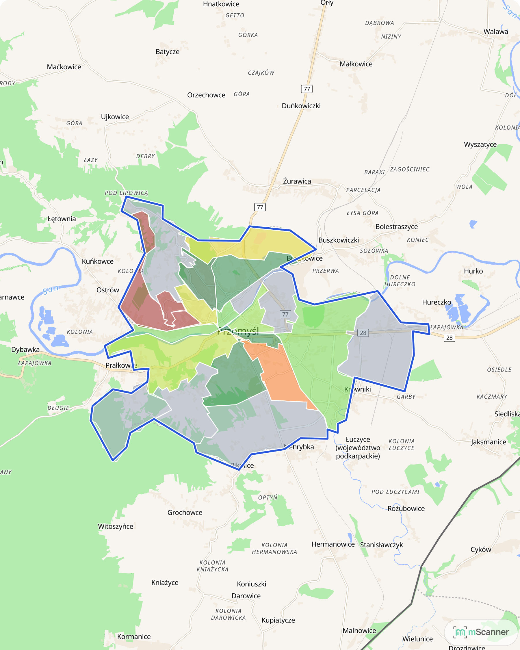 Mapa Przemyśla z niebieską granicą administracyjną i sześciokątami pokolorowanymi według mediany ceny transakcyjnej mieszkań, po obu stronach Sanu