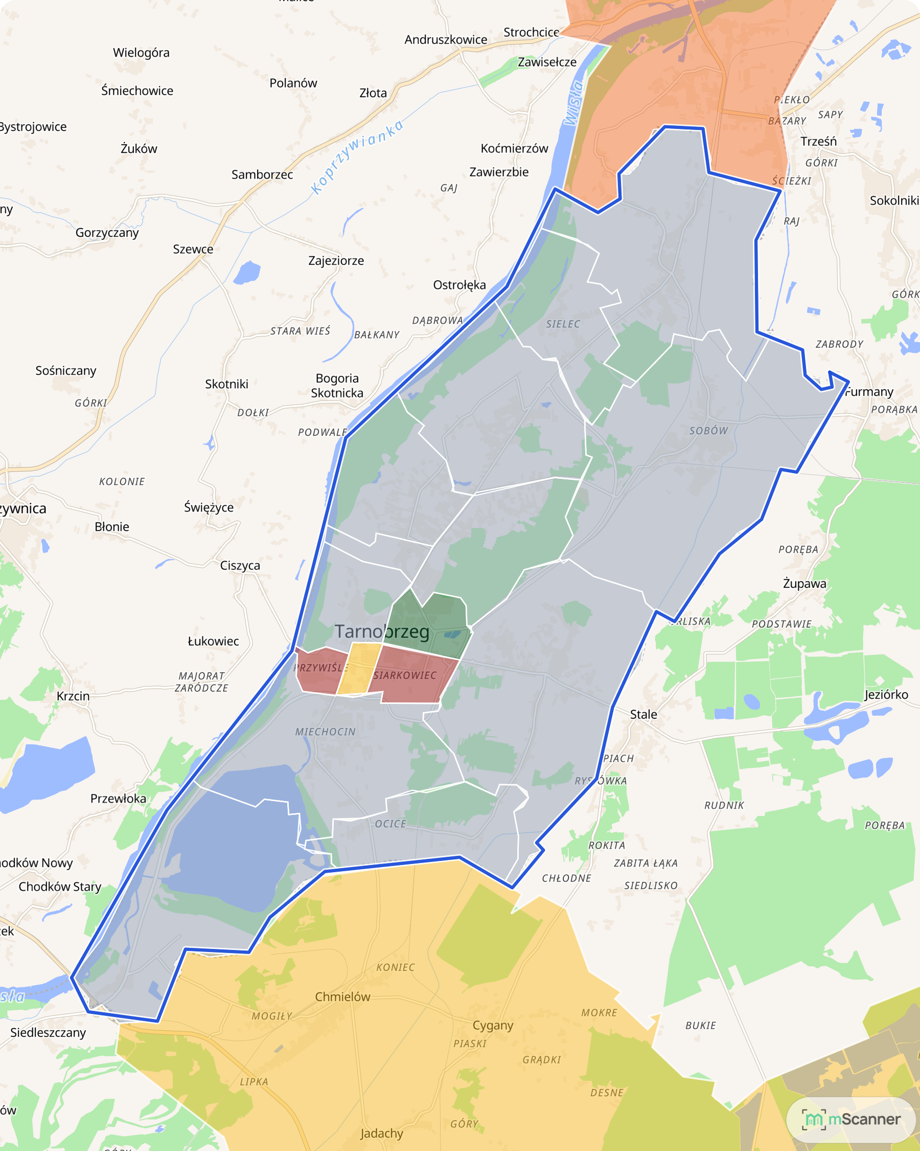 Mapa Tarnobrzega z niebieską granicą administracyjną i osiedlami pokolorowanymi według mediany ceny transakcyjnej mieszkań, nad Wisłą i Jeziorem Tarnobrzeskim