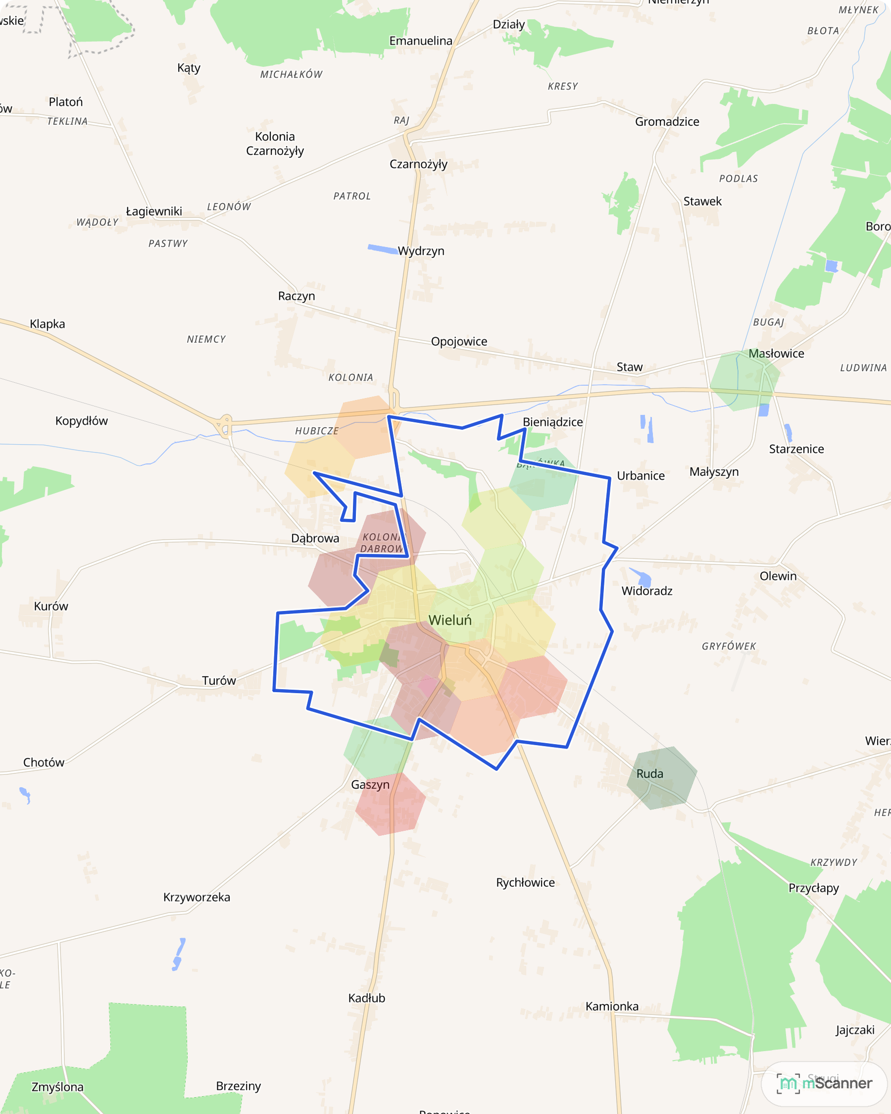 Mapa Wielunia z granicą administracyjną gminy zaznaczoną niebieską linią i sześciokątnymi polami cen transakcyjnych w kolorach od zielonego do czerwonego, skupionymi w zwartej zabudowie miasta