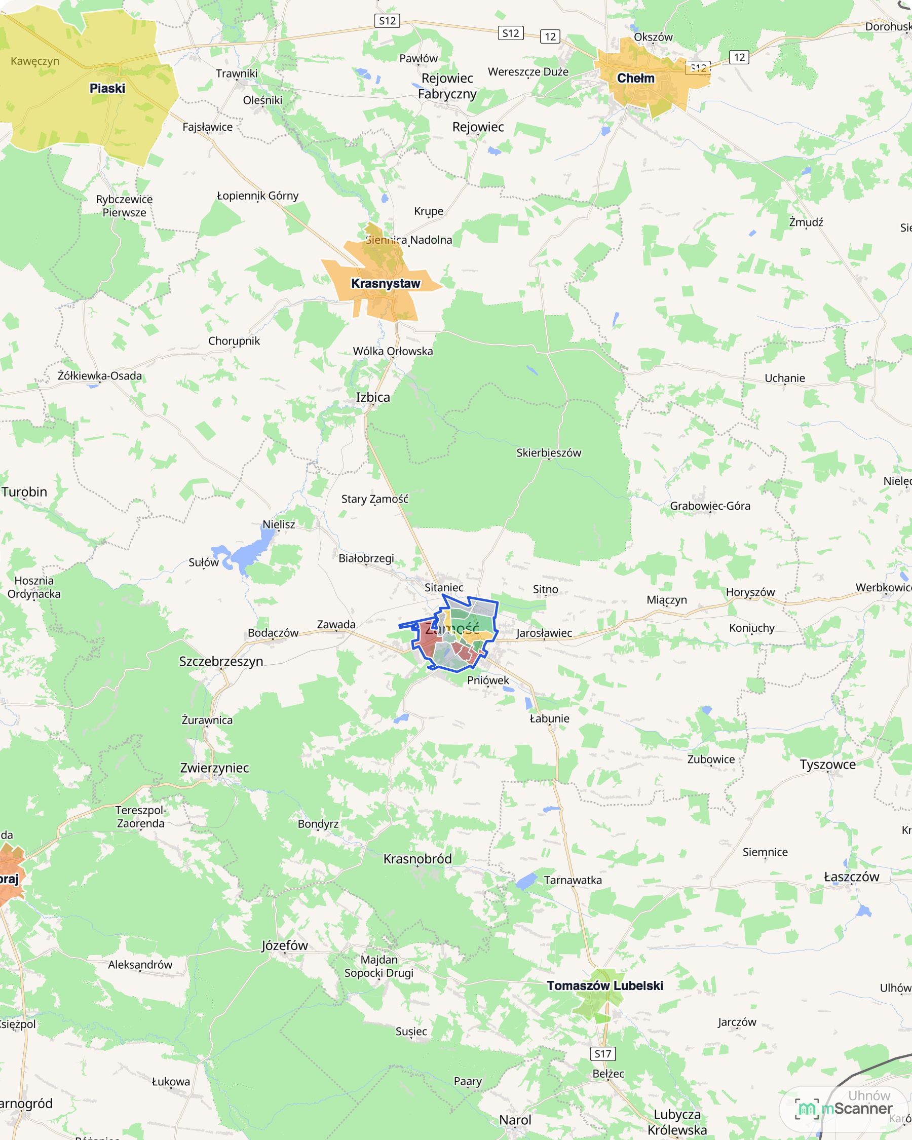 Mapa cen transakcyjnych mieszkań na południu województwa lubelskiego, z niebieskim obrysem granic Zamościa na wschodzie, Kraśnikiem i Janowem Lubelskim na zachodzie oraz Biłgorajem w środku.