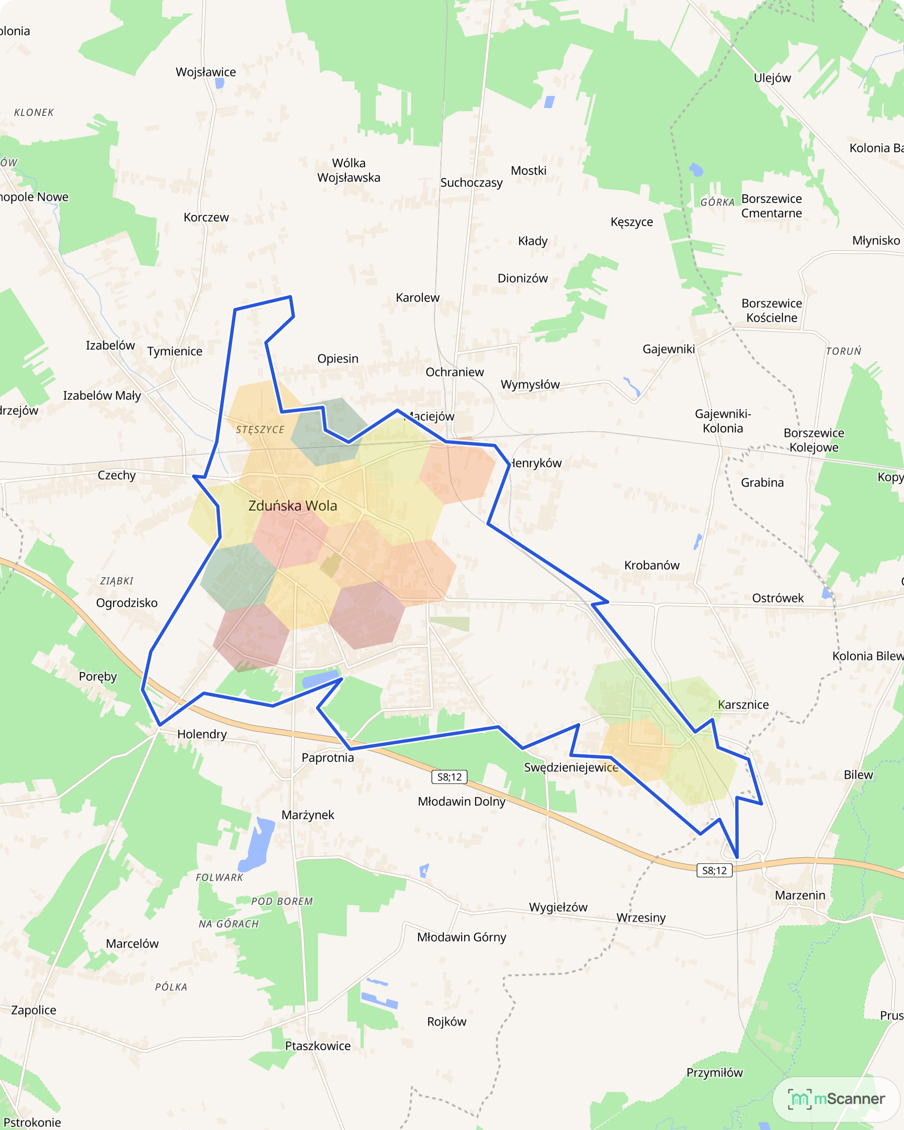 Mapa Zduńskiej Woli z granicą administracyjną miasta zaznaczoną niebieską linią i gęstą siatką sześciokątnych pól cen transakcyjnych w kolorach od zielonego przez żółty do czerwonego, wypełniającą całe centrum